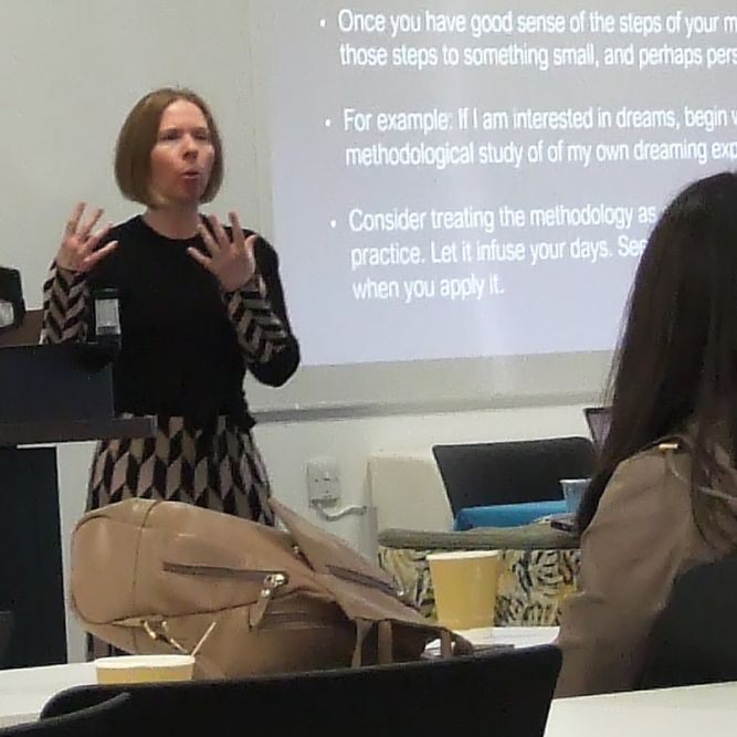  Faith Harkey giving a presentation to academic researchers 
